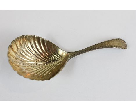 A George IV silver caddy spoon, maker WB London 1827, with shell shaped bowl