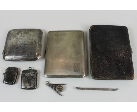 Two silver cigarette cases (initialled), a silver mounted wallet with initials CA, two silver Vesta cases, a silver swizzle s