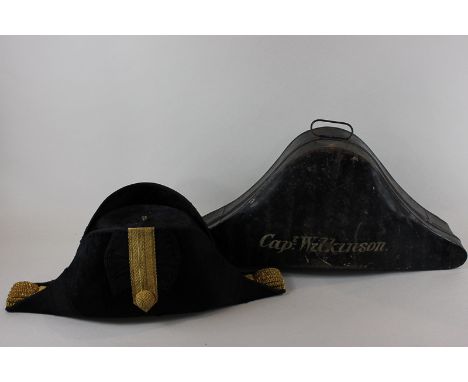 A Naval officer's bicorn dress hat with gilt braid, in metal case stamped Capt Wilkinson 