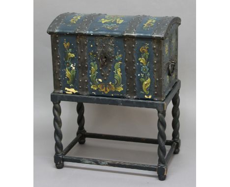 NORWEGIAN PAINTED TRUNK, 18th century, the domed cover enclosing a candle box interior, the iron strapwork interspersed with 