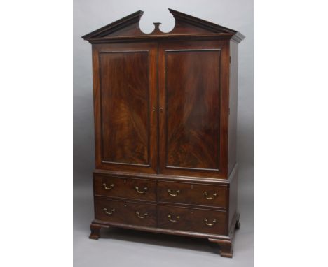 GEORGE III MAHOGANY LINEN PRESS, the triangular pediment above a pair of panelled doors, the base with four, cockbeaded drawe