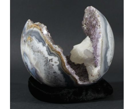 POLISHED CRYSTAL GEODE, probably amethyst with secondary white crystals, possibly quartz, in a polished part sphere geode, di