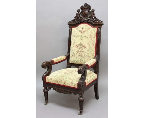 OAK THRONE CHAIR, 19th century, the crest supported by two cherubs above a tapestry upholstered back and seat, scrolling and 