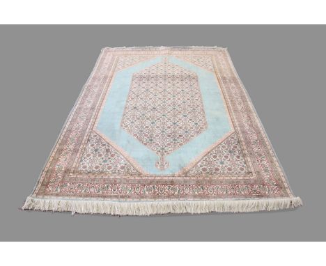 KASHMIR CARPET, North West India, second half 20th century, silk piled, the aquamarine field with a central field Herati loze