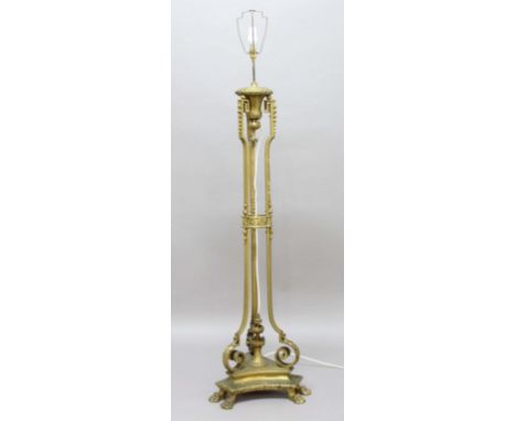 FRENCH GILT METAL STANDARD LAMP, the central, vase shaped mount on three supports with foliate and scrolling decoration on a 