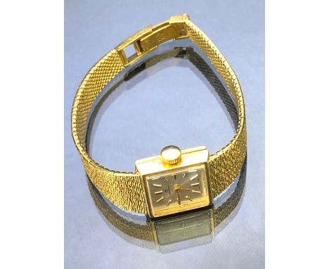 Bucherer 18ct gold manual wind wristwatch with 18ct Gold strap, square silver face approx 29.3g