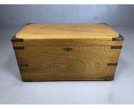Light wood brass bound campaign chest, with brass handles, approx 65cm x 34cm x 34cm tall