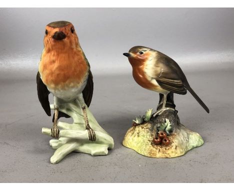 Two ceramic Robins, the first by Royal Crown Derby approx 10cm in height, the second by Goebel approx 12cm in height