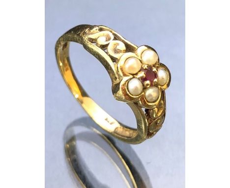 9ct Gold ring set with seed Pearls around a central garnet approx size 'M' and 2.6g