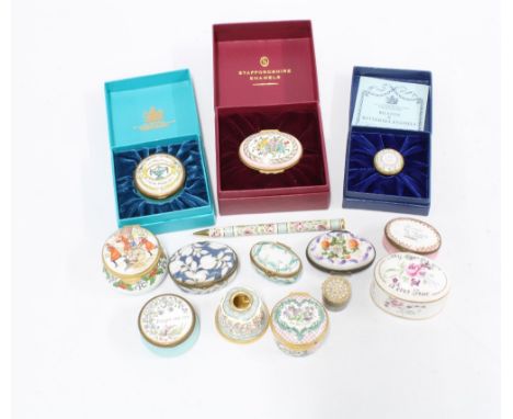 A collection of enamel pill boxes to include Halcyon Days and Staffordshire enamels together with a Halcyon Days enamel pen a
