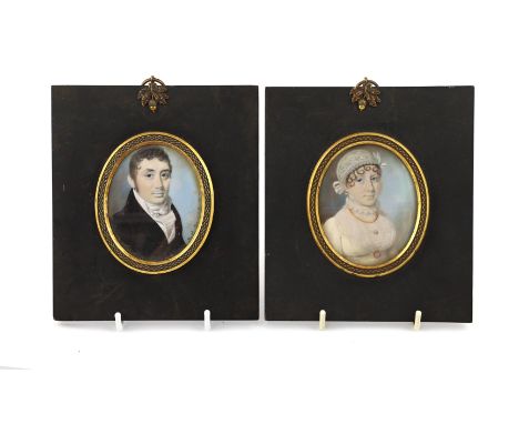 Y Thomas Richmond (British, 1771-1837) Portrait miniatures of a lady and gentlemanwatercolour on ivory (2)he wearing a black 