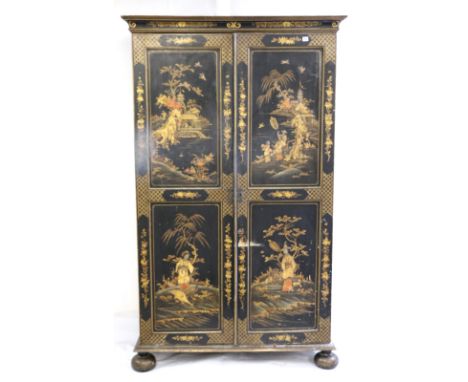 19th century Chinoiserie ebonised wardrobe decorated with garden scenes, figures and birds raised on bun supports, 210cm x 12