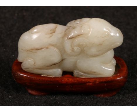 Carved jade model of a ram on stand, 4cm long