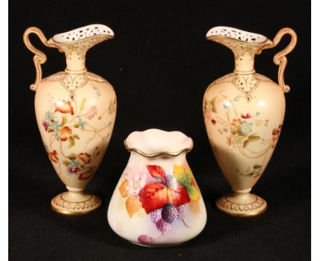 Pair of Royal Worcester vases of ewer form having ribbon handles and reticulated spout, the blush ivory ground decorated with