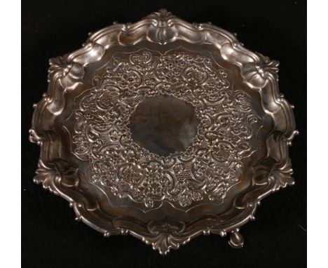 Silver tea pot stand or waiter of rounded rectangular shape, pin struck, on scalloped feet by Urquhart & Hart, mark mis-struc