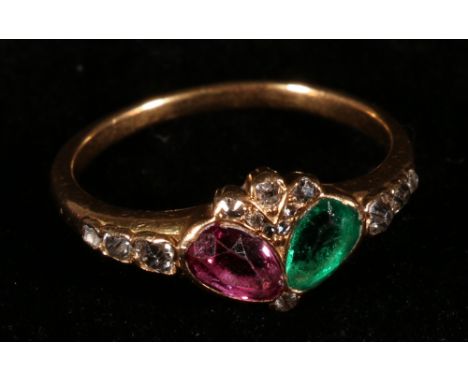 Ring with a ruby and emerald of pear shape set at an angle with spray and shoulders of small diamonds, c1900 CONDITION REPORT