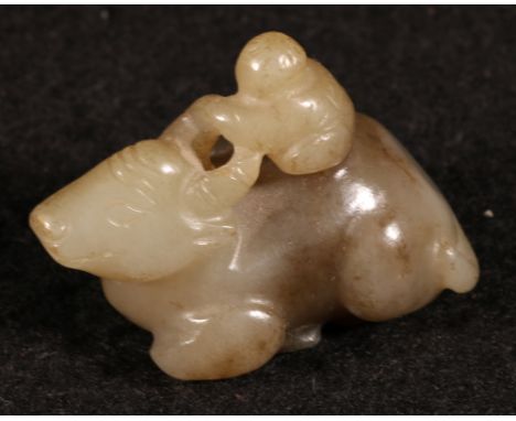 Carved jade model of a man riding a bull, 4.5cm long CONDITION REPORT: Some minor wear to the body