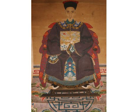 Three late 19th century or early 20th century Chinese painted scrolls, one of a seated courtier in traditional robe with rank