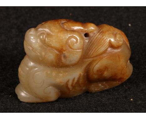 Carved jade model of a dragon, 5cm long