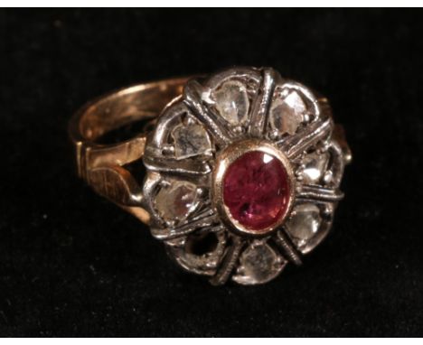 Ring with collet set ruby and seven rose diamonds (formerly eight) in gold and silver