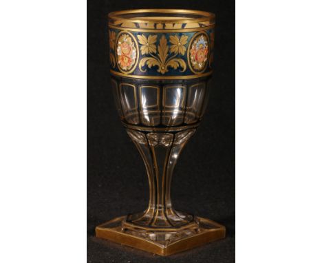 19th century Bohemian flash glass goblet decorated with gilt bands and blue border having painted floral vignettes raised on 