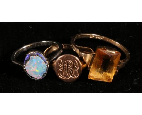 Gold ring with citrine and another with opal doublet both '9ct' and a signet ring