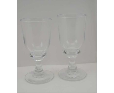 TWO GEORGIAN DESIGN WINE GLASSES, high knopped stems, on circular platform bases, one 16cm high, the other 16.5cm high 