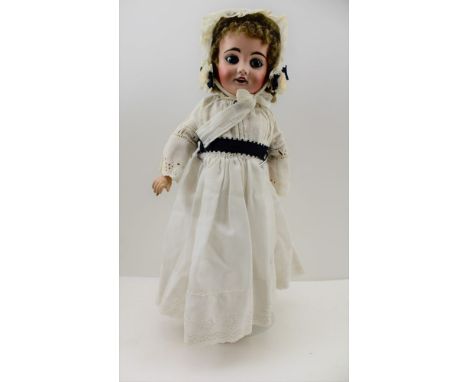 A LIMOGES BISQUE HEADED DOLL, with composition body, impressed factory marks to the back of the neck include "Cherie 4", 40cm