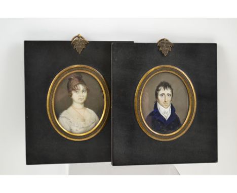 A PAIR OF REGENCY DESIGN MINIATURE PORTRAIT PAINTINGS, a gentleman and a lady, 7cm x 5.5cm, in ebonised and gilt mounted fram