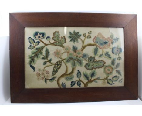 AN EARLY 20TH CENTURY CREWEL WORK TAPESTRY WOOL PANEL, stylised floral design in coloured threads, monogrammed and dated 1924