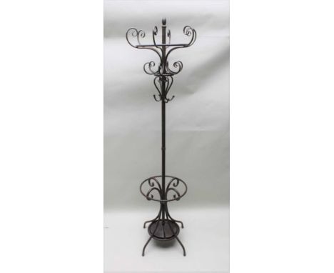 A 20TH CENTURY WROUGHT METAL FREE STANDING HAT, COAT AND STICK STAND after the design by Thonet, the base having two insert d