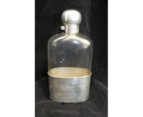 A "DREW &amp; SONS" TRAVELLING SPIRIT FLASK silver plated, with bayonet fit stopper with removable plated cup base, having bl