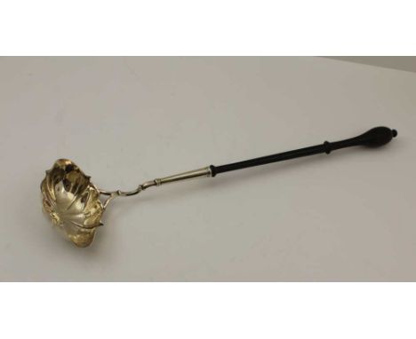 A 19TH CENTURY PUNCH LADLE, the white metal double lipped fluted bowl attached to a turned wood handle, 40cm long 