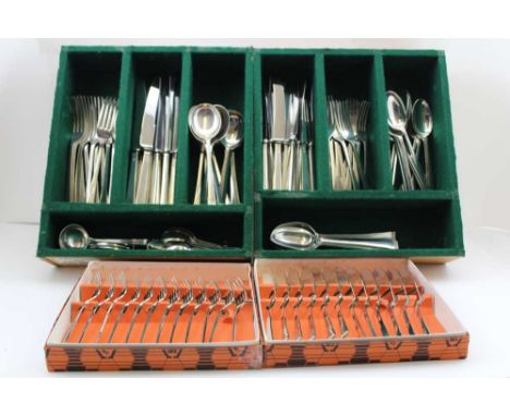 COOPER BROTHERS &amp; SONS LTD A SET OF SILVER FLATWARE, cutlery for twelve place settings, having scroll terminal to handles