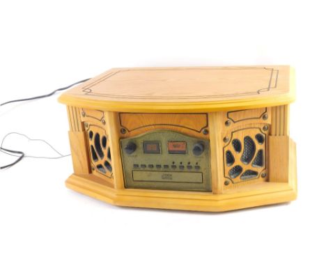 A modern wooden cased compact disc player, with front speakers and upper turntable, with lid, 21cm high, 48cm wide, 34cm deep