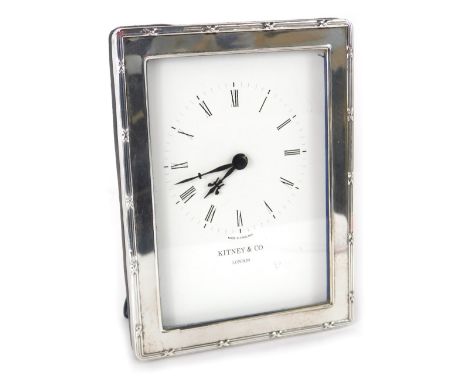 An Elizabeth II silver framed table clock, by Kitney and Co London, with stencilled 9cm wide back plate and easel back. 