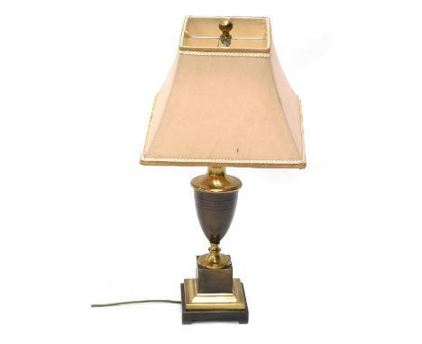 A table lamp, with urn stem, on stepped square base terminating in bracket feet, with modern shade and electrical fitting, 75