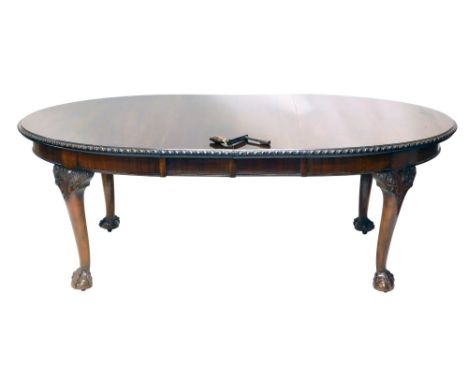 A Chippendale style dining room suite, comprising D end wind out table, with a moulded outline, on heavy legs carved with flo