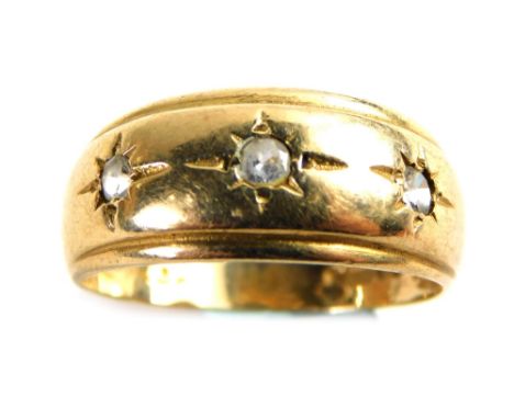 A 9ct gold ring, with a shaped panel set with three old cut diamonds, each illusion set, approx 0.05ct, ring size R½, 3.2g al