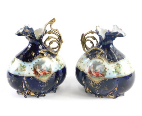 A pair of 20thC Continental porcelain ewers, each transfer printed with figures of ladies dressed in finery, predominately in