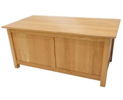 A late 20thC light oak two panelled coffer, the plain rectangular top, on block stiles, 51cm high, 110cm wide, 61cm deep. 