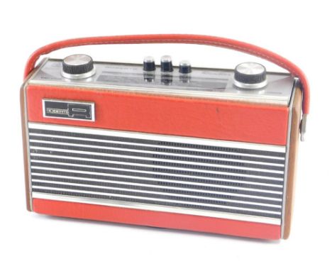 A vintage Roberts Rambler radio, in part wooden casing, 21cm wide. 