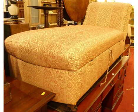 A cream and red floral striped fabric upholstered boxbase day-bed, having removable domed seat, on roller castors, length 160