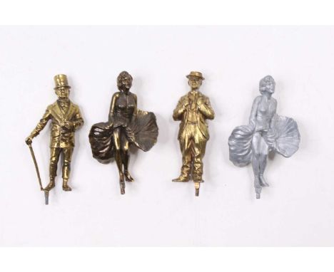 A collection of cast metal Lonestar products, figurines of Marilyn Monroe, Charlie Chaplin, and WC Fields, one Marilyn Monroe