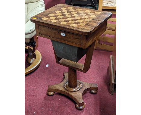 A William IV rosewood and inlaid chessboard topped work table, having single frieze door over basket drawer to quatraform bas