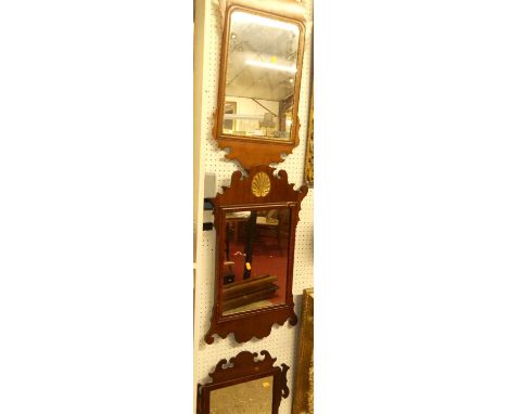 Three various circa 1900 mahogany fret-cut wall mirrors, each in the Chippendale styleEach with losses and damage.