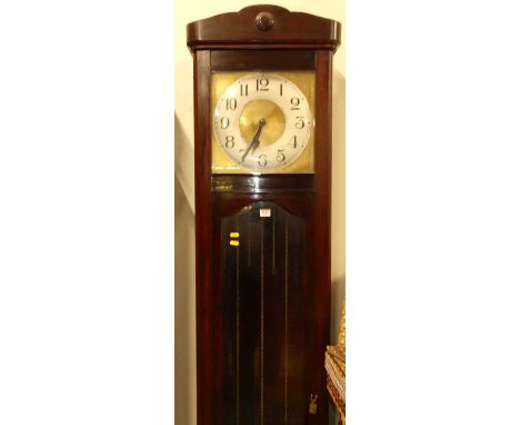 A 1920s stained beechwood longcase clock, having painted metal square Arabic dial, three train weight driven striking and chi