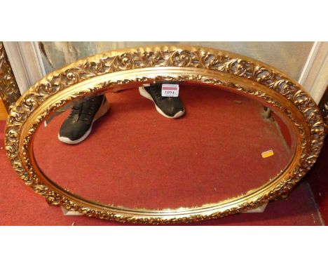 A modern gilt framed oval wall mirror, 70cm, together with a framed oleograph, and two amateur landscape oils (4)