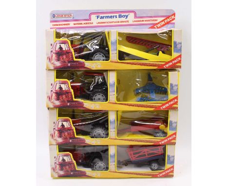 A Lonestar Farmer's Boy, farm machinery tractor and implement gift set, four various examples, all with different farm machin