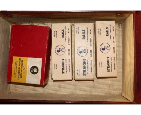 A suitcase containing a quantity of Trix model railways to include a British Railways Express locomotive 4-6-2Loco present in